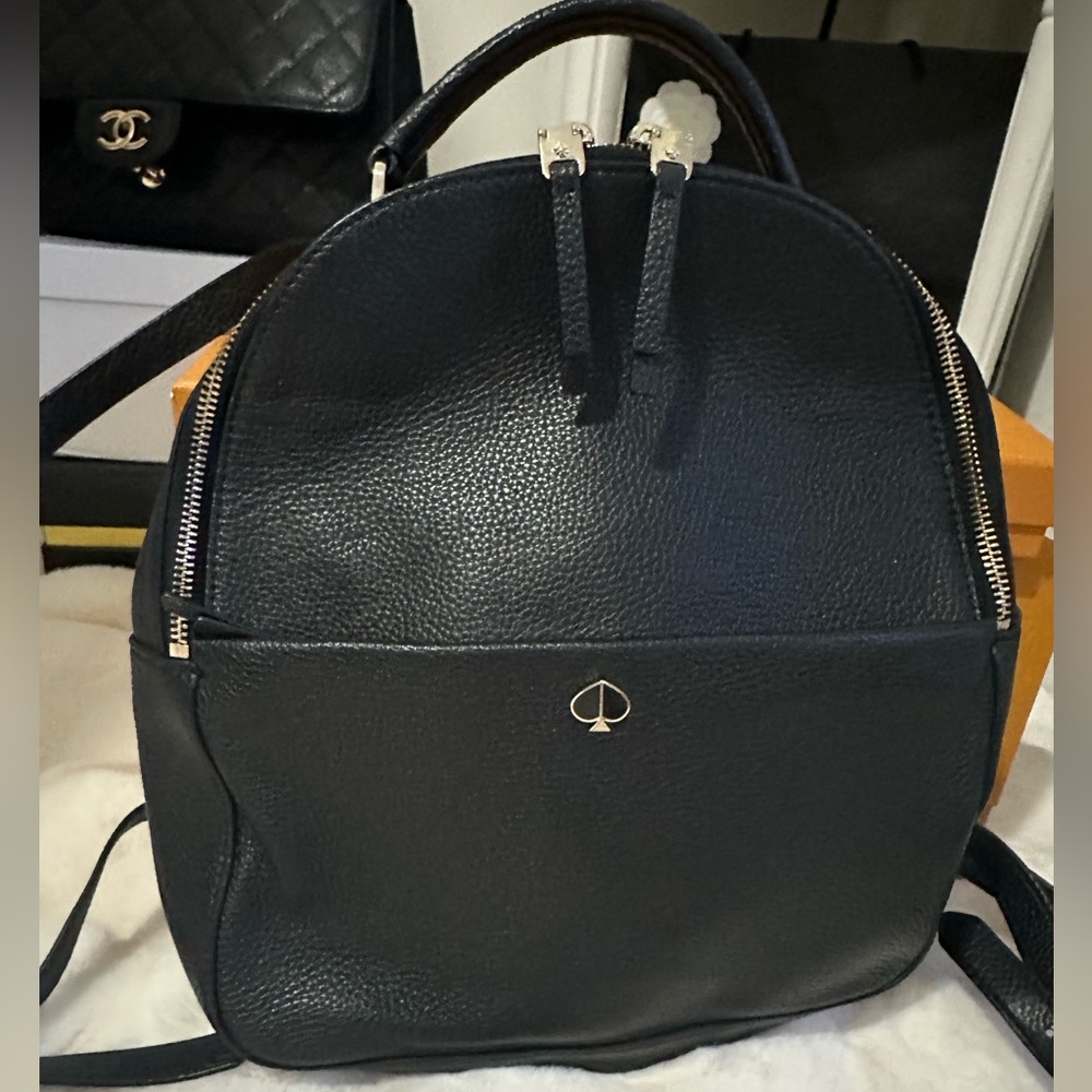 Kate Spade Polly Medium Backpack in black (Size: 12”h x 10.75””w x 4.25”d)